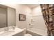 Clean bathroom with a bathtub, shower, and modern vanity at 3307 Train St, Buford, GA 30519