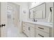 Bathroom with white vanity, marble countertop and hexagon tile floor at 1617 Fernstone Nw Dr, Acworth, GA 30101