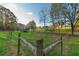 Wooded pasture with wooden fence and small animal shelter at 2292 Acworth Due West Nw Rd, Acworth, GA 30101