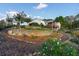 Landscaped yard with retaining wall and flowering plants at 2292 Acworth Due West Nw Rd, Acworth, GA 30101
