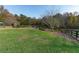 Large grassy pasture with trees and wooden fence at 2292 Acworth Due West Nw Rd, Acworth, GA 30101