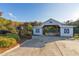 White barn with stalls and a gated entrance, ideal for horses at 2292 Acworth Due West Nw Rd, Acworth, GA 30101