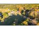 Aerial view of house and expansive lot with mature trees and autumn colors at 2292 Acworth Due West Nw Rd, Acworth, GA 30101