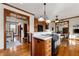 Kitchen island with cooktop and a view into adjacent living areas at 2292 Acworth Due West Nw Rd, Acworth, GA 30101