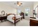 Bedroom with wooden post bed, ample natural light, and hardwood floors at 2292 Acworth Due West Nw Rd, Acworth, GA 30101
