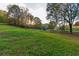 Pasture with trees and a wooden fence at 2292 Acworth Due West Nw Rd, Acworth, GA 30101