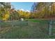 Pasture with a gate and tranquil wooded backdrop at 2292 Acworth Due West Nw Rd, Acworth, GA 30101