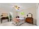 Charming bedroom with wooden furniture and a view of the backyard at 2292 Acworth Due West Nw Rd, Acworth, GA 30101
