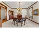 Formal dining room featuring a round table and built-in hutch at 2292 Acworth Due West Nw Rd, Acworth, GA 30101