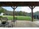 Covered patio with seating area overlooking the backyard at 2292 Acworth Due West Nw Rd, Acworth, GA 30101