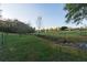 Pasture with a creek and trees, creating a serene landscape at 2292 Acworth Due West Nw Rd, Acworth, GA 30101