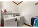 Bright laundry room, washer, dryer, and shelving at 2292 Acworth Due West Nw Rd, Acworth, GA 30101