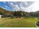 Open pasture with trampoline and wooden fence at 2292 Acworth Due West Nw Rd, Acworth, GA 30101