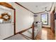 Upstairs hallway with hardwood floors and access to bedrooms at 2292 Acworth Due West Nw Rd, Acworth, GA 30101