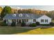 White farmhouse with wrap-around porch at 2292 Acworth Due West Nw Rd, Acworth, GA 30101
