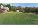 Spacious backyard with green lawn and distant barn at 2292 Acworth Due West Nw Rd, Acworth, GA 30101
