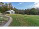 White barn with green doors, in a grassy backyard at 2292 Acworth Due West Nw Rd, Acworth, GA 30101