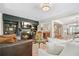 Spacious living room with fireplace and built-in shelving at 4201 Village Green Dr, Roswell, GA 30075