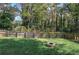 Large backyard with fire pit and wooden fence at 1204 Westridge Sw Rd, Atlanta, GA 30311