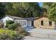 House exterior showcasing a renovated ranch home with stone and white siding at 1825 Niskey Lake Rd, Atlanta, GA 30331