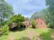 Brick house with large backyard and mature trees at 1171 Rocky Creek Rd, Locust Grove, GA 30248