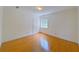 Bright bedroom with hardwood floors and ample natural light at 1171 Rocky Creek Rd, Locust Grove, GA 30248