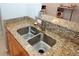 Modern kitchen with granite countertops and double sink at 799 Hammond Dr # 116, Atlanta, GA 30328