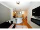 Spacious living room with hardwood floors, fireplace, and large TV at 799 Hammond Dr # 116, Atlanta, GA 30328