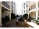 Shared courtyard with stonework, landscaping, and building access at 799 Hammond Dr # 116, Atlanta, GA 30328