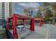 Relaxing pool area with red canopies and seating at 799 Hammond Dr # 116, Atlanta, GA 30328