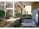 Private patio with a small couch and access to the building at 799 Hammond Dr # 116, Atlanta, GA 30328
