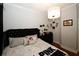 Spacious bedroom with a king-size bed, hardwood floors, and neutral decor at 799 Hammond Dr # 116, Atlanta, GA 30328