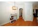 Bright dining area with hardwood floors and modern chandelier at 799 Hammond Dr # 116, Atlanta, GA 30328