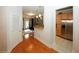 Light and bright entryway with hardwood floors, leading to kitchen and living areas at 799 Hammond Dr # 116, Atlanta, GA 30328