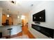 Open concept living room with hardwood floors and fireplace at 799 Hammond Dr # 116, Atlanta, GA 30328