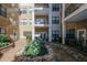 Inviting courtyard with stonework and lush landscaping at 799 Hammond Dr # 116, Atlanta, GA 30328