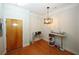 Bright dining area with hardwood floors and modern chandelier at 799 Hammond Dr # 116, Atlanta, GA 30328