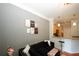 Living room features a black velvet couch and built-in kitchen bar at 799 Hammond Dr # 116, Atlanta, GA 30328
