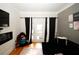 Comfortable living room featuring hardwood floors and a cozy seating area at 799 Hammond Dr # 116, Atlanta, GA 30328