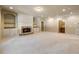 Finished basement with fireplace and built-in shelving at 1256 Stonecroft Way, Marietta, GA 30062