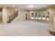 Finished basement with neutral carpeting and large windows at 1256 Stonecroft Way, Marietta, GA 30062