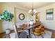 Formal dining room features hardwood floors, chandelier, and decorative mirror at 1256 Stonecroft Way, Marietta, GA 30062