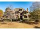 Brick house with stone accents, double front doors, and manicured lawn at 1256 Stonecroft Way, Marietta, GA 30062