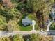 Aerial view of house and lot, showing its location in a wooded area at 2788 Browns Mill Se Rd, Atlanta, GA 30354