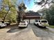 Two-car brick garage with a long driveway, providing ample parking space at 25 Dogwood Ct, Mcdonough, GA 30252