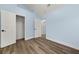 Spacious bedroom with light blue walls and ample closet space at 6223 Apa Ln, Lithonia, GA 30058