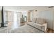 Open living room with beige couch, kitchen island, and wood floors at 4701 Flat Shoals Rd # 54C, Union City, GA 30291