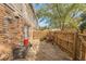 Small brick patio with wood fence and gate at 4701 Flat Shoals Rd # 54C, Union City, GA 30291