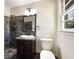 Bathroom with walk-in shower and dark tile at 3811 Reynolds Rd, Douglasville, GA 30135