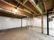 Partially finished basement with exposed beams and unfinished walls at 3811 Reynolds Rd, Douglasville, GA 30135